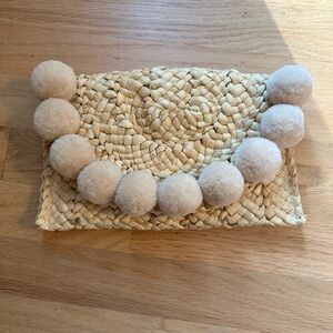 Woven Clutch with Pom Poms